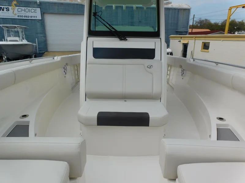 Slide: The Image of 2024 Sailfish 312 CC center console boat interior with seating and storage compartments. - 18