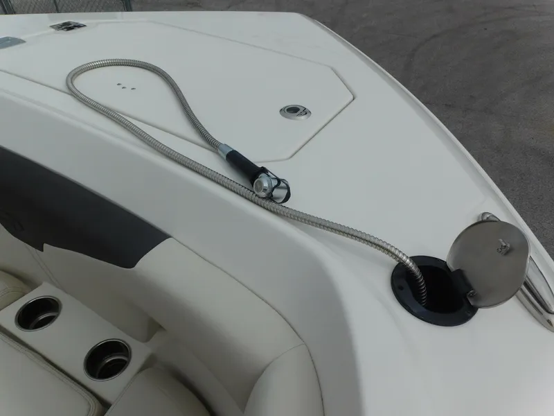 Slide: The Image of 2024 Sailfish 312 CC boat deck with hose and seating area. - 20