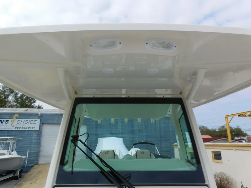 Slide: The Image of 2024 Sailfish 312 CC boat hardtop and windshield view. - 21