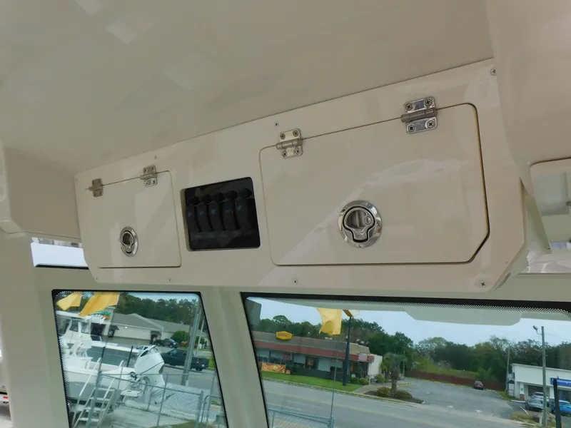 Slide: The Image of Overhead storage compartments in 2024 Sailfish 312 CC boat. - 27