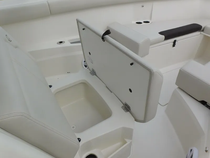 Slide: The Image of 2024 Sailfish 312 CC boat interior with open storage compartment. - 35