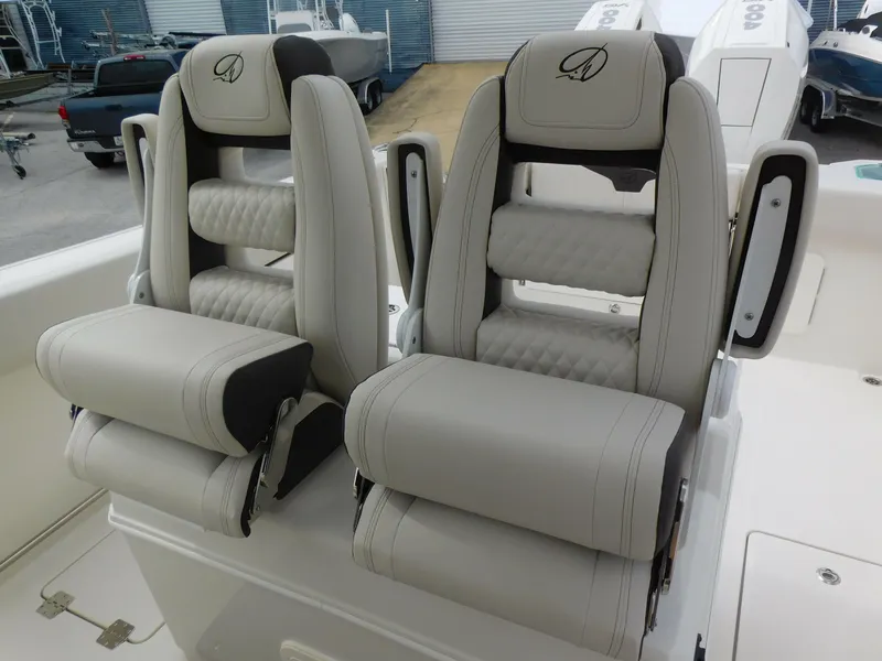 Slide: The Image of 2024 Sailfish 312 CC boat with luxurious dual captain's chairs. - 36