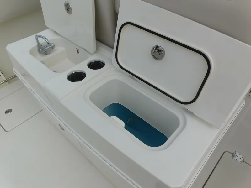 Slide: The Image of 2024 Sailfish 312 CC boat sink and storage compartments. - 41