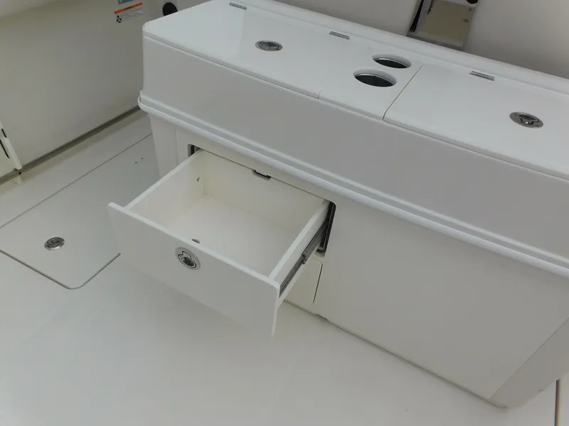 Slide: The Image of Open storage drawer on 2024 Sailfish 312 CC boat. - 43