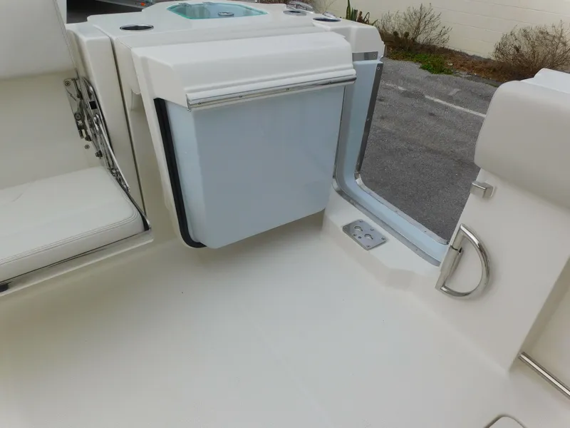 Slide: The Image of 2024 Sailfish 312 CC boat interior with seating and storage compartment. - 48