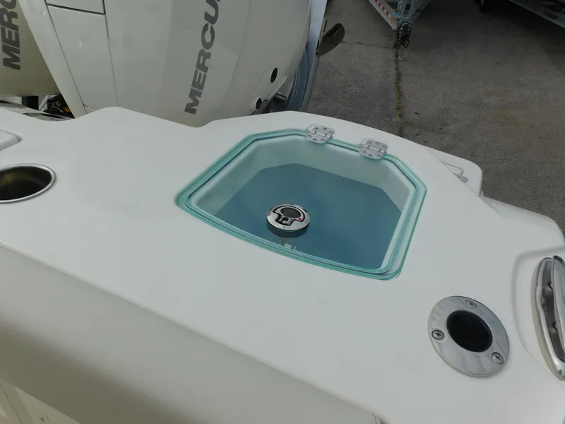 Slide: The Image of 2024 Sailfish 312 CC boat with Mercury engine and livewell. - 49