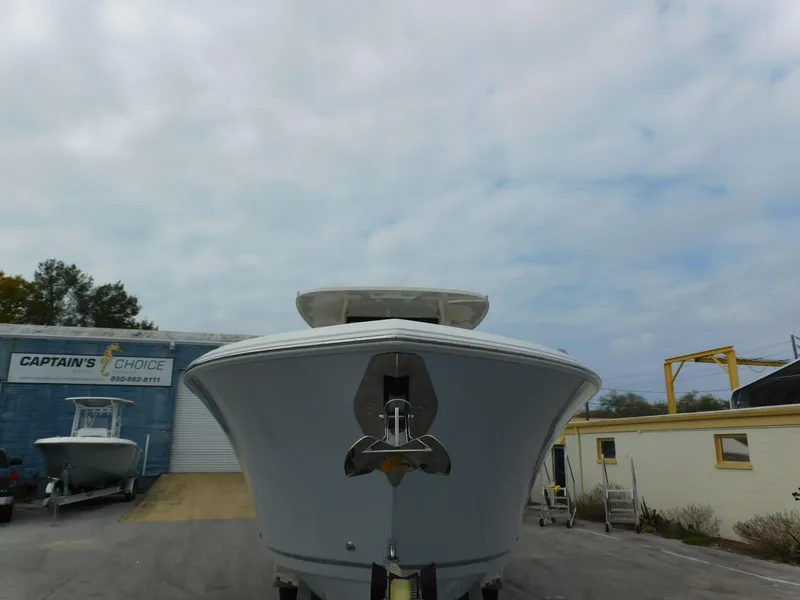 Slide: The Image of Front view of a 2024 Sailfish 312 CC boat at a dealership. - 6