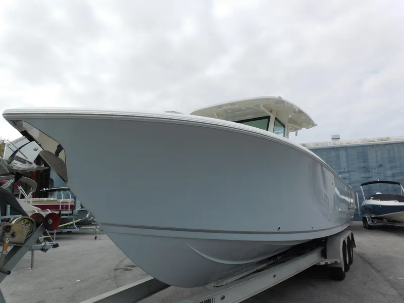 Slide: The Image of 2024 Sailfish 312 CC boat on a trailer, side view. - 7