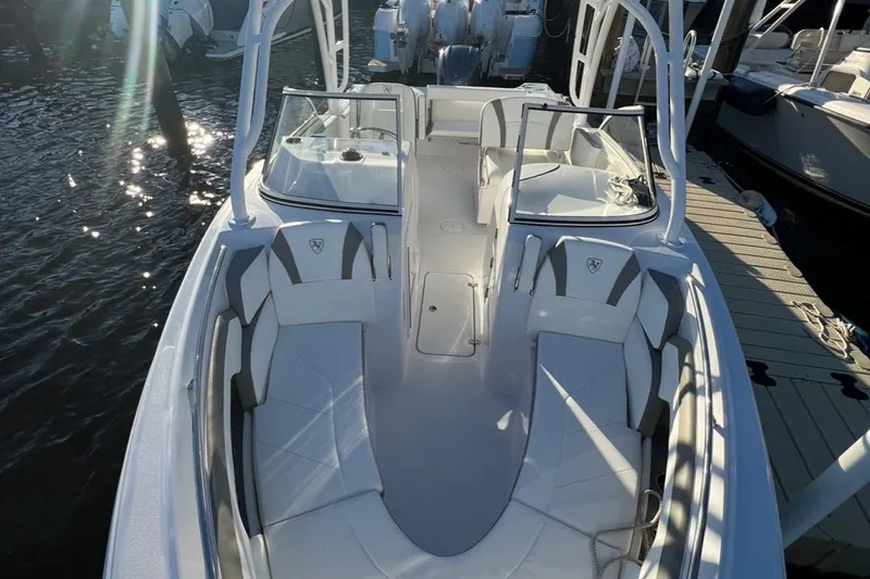 Slide: The Image of 2022 Century Resorter boat with spacious seating docked at marina. - 2