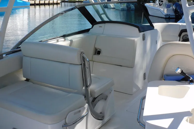 Slide: The Image of Century Resorter 2022 boat interior with white leather seating and waterfront view. - 5