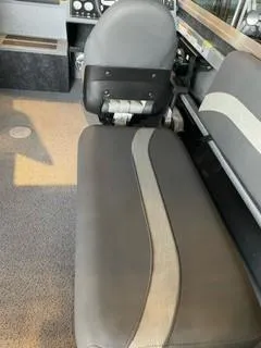 Slide: The Image of Interior seating of 2024 Spartan 200 Astoria with gray and black upholstery. - 3