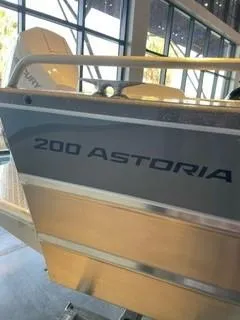 Slide: The Image of 2024 Spartan 200 Astoria boat displayed indoors. - 8