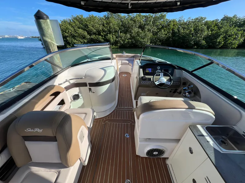 Slide: The Image of 2012 Sea Ray 300 SLX boat interior with luxurious seating and modern dashboard. - 15