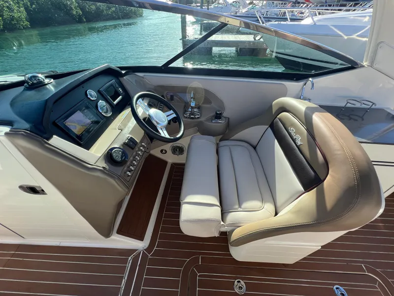 Slide: The Image of Interior of 2012 Sea Ray 300 SLX boat with steering wheel and seating. - 16