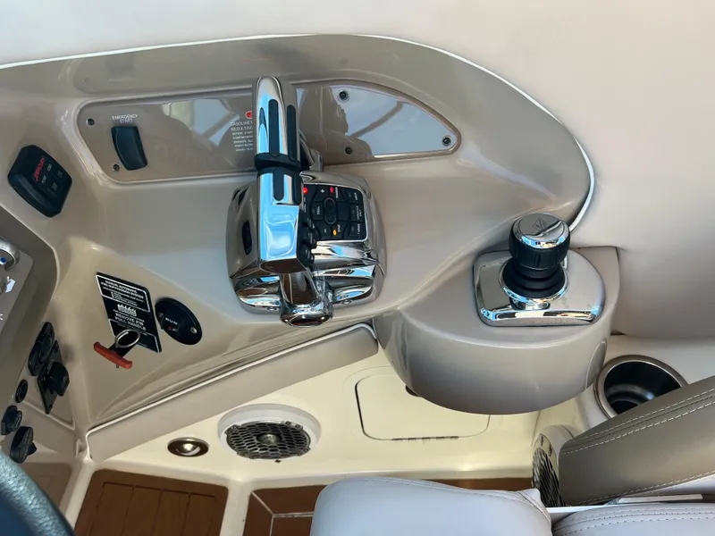 Slide: The Image of 2012 Sea Ray 300 SLX boat controls and dashboard, featuring modern navigation equipment. - 19