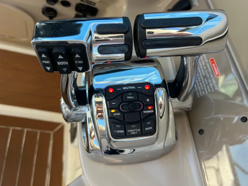 Slide: The Image of Close-up of 2012 Sea Ray 300 SLX boat throttle controls. - 20