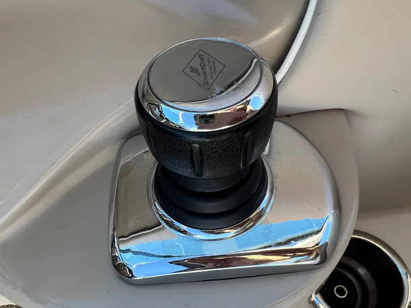 Slide: The Image of 2012 Sea Ray 300 SLX boat control knob, chrome finish, close-up view. - 21