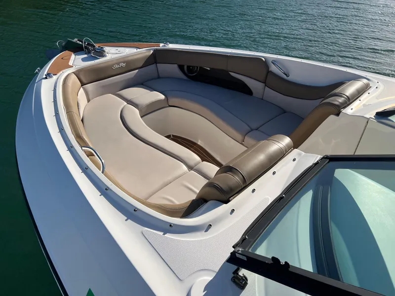 Slide: The Image of Luxurious seating on 2012 Sea Ray 300 SLX boat, docked on calm water. - 35