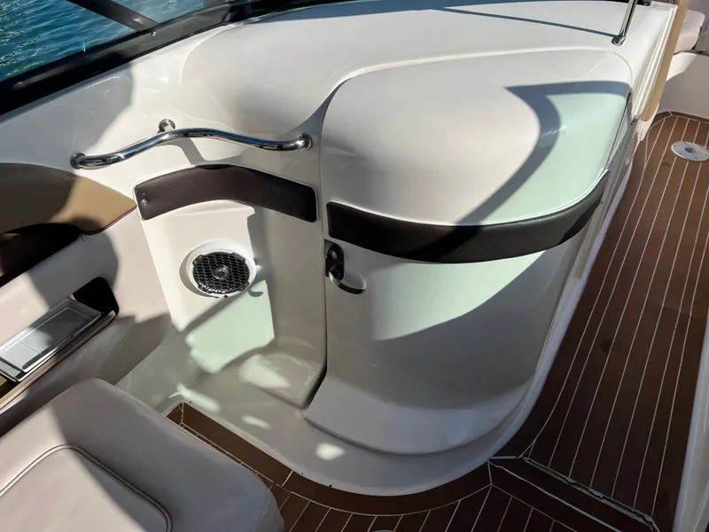 Slide: The Image of Interior of 2012 Sea Ray 300 SLX boat with sleek design and wood flooring. - 38