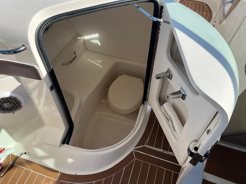 Slide: The Image of 2012 Sea Ray 300 SLX boat bathroom interior with open door. - 39