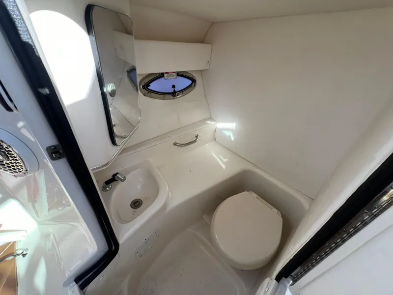 Slide: The Image of Interior of 2012 Sea Ray 300 SLX boat bathroom with sink and toilet. - 40