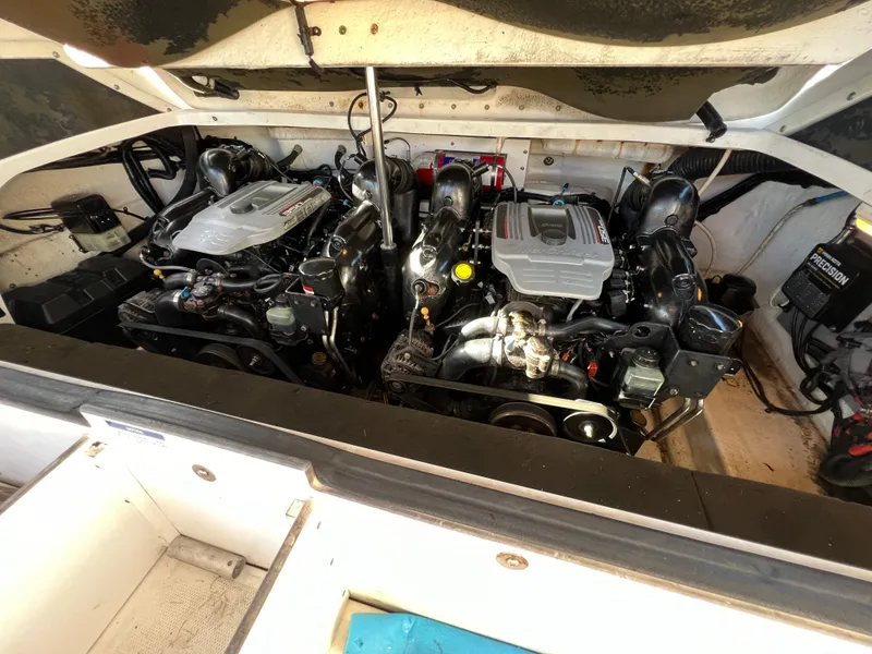 Slide: The Image of Engine compartment of 2012 Sea Ray 300 SLX boat, showcasing dual engines. - 42