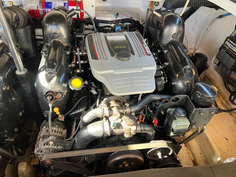 Slide: The Image of 2012 Sea Ray 300 SLX engine compartment with MerCruiser engine components. - 43
