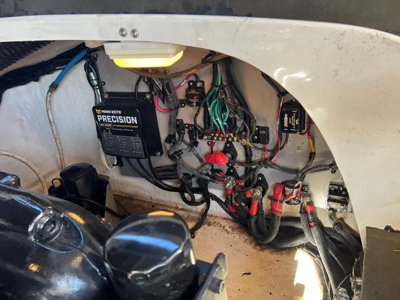 Slide: The Image of Engine compartment of 2012 Sea Ray 300 SLX with wiring and Minn Kota Precision charger. - 45