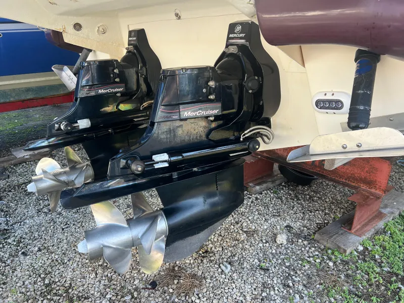 Slide: The Image of 2012 Sea Ray 300 SLX with dual MerCruiser outdrives on gravel. - 49