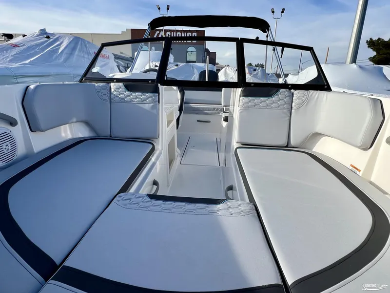 Slide: The Image of 2024 Bayliner M19 boat interior with cushioned seating and modern design. - 3