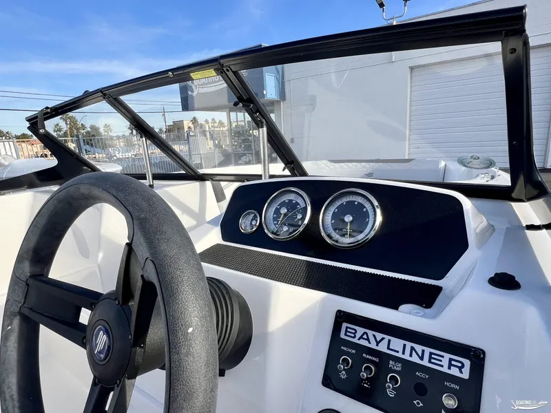 Slide: The Image of 2024 Bayliner M19 boat dashboard with steering wheel and gauges. - 4