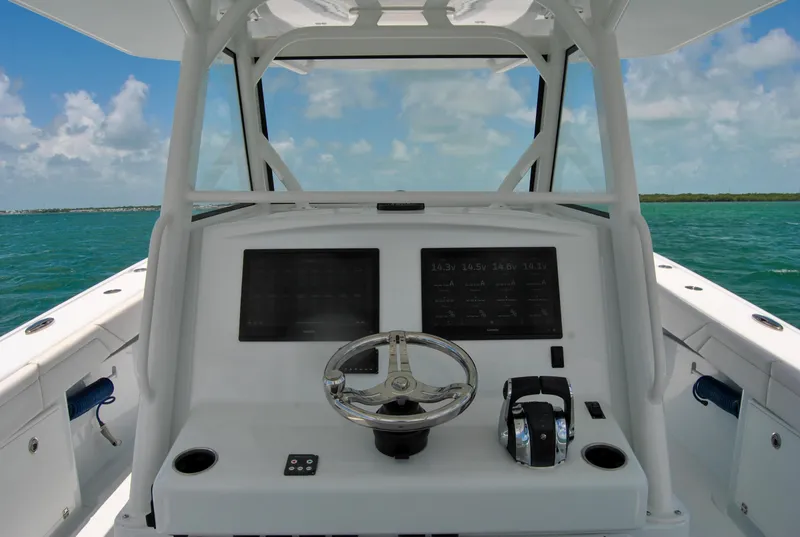 Slide: The Image of 2022 Yellowfin 39 Offshore boat helm with ocean view. - 18