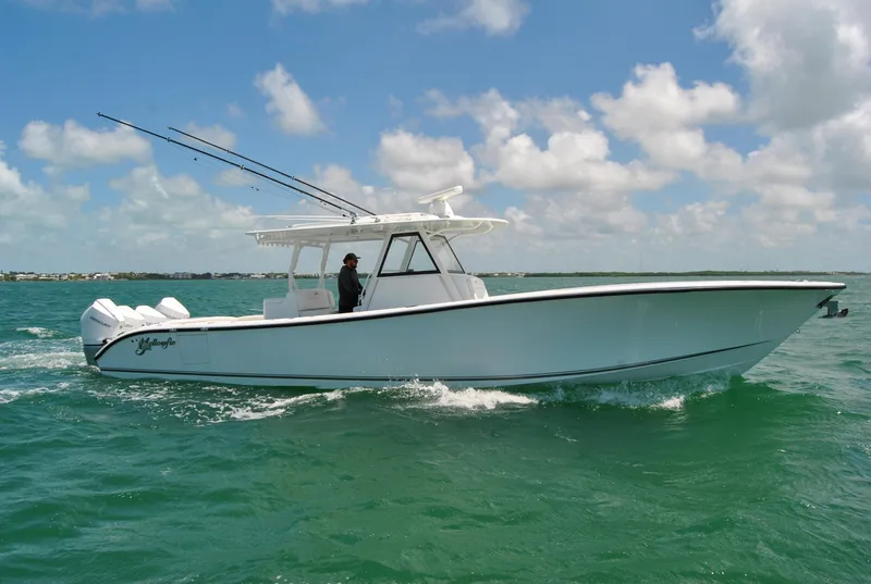 Slide: The Image of 2022 Yellowfin 39 Offshore boat cruising on open water under a clear sky. - 6