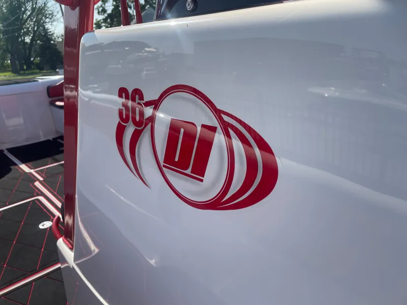 Slide: The Image of 2008 Deep Impact 36di boat logo in red on white hull. - 15