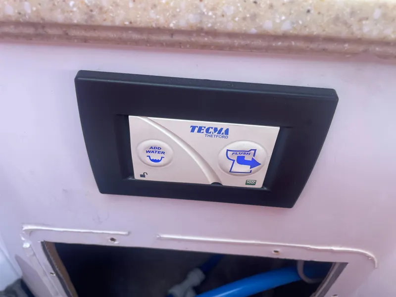 Slide: The Image of Control panel of Tecma toilet system in a 2008 Deep Impact 36di boat. - 24