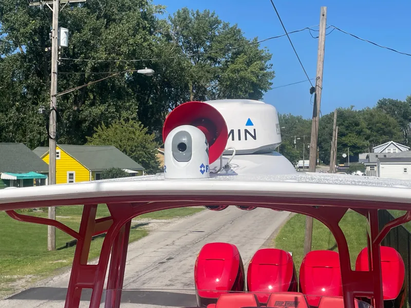 Slide: The Image of 2008 Deep Impact 36di boat with red seats and Garmin radar. - 41