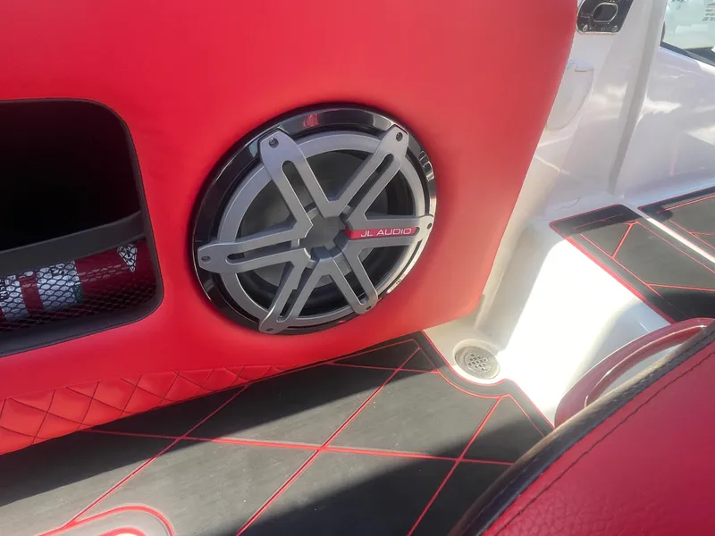 Slide: The Image of 2008 Deep Impact 36di boat interior with red and black upholstery and JL Audio speaker. - 43