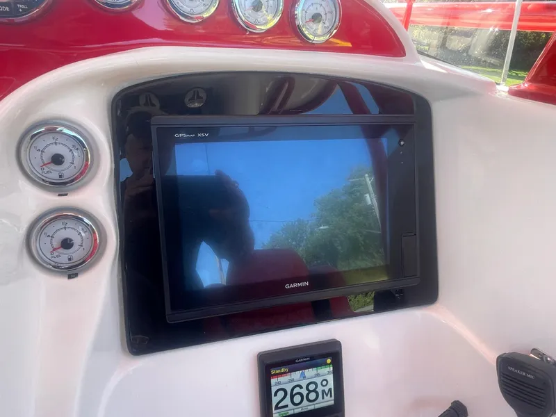 Slide: The Image of 2008 Deep Impact 36di boat dashboard with Garmin GPS and gauges. - 45