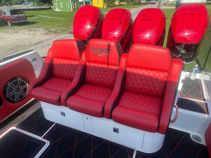 Slide: The Image of Red leather seats on a 2008 Deep Impact 36di boat with four outboard motors. - 8