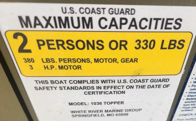Slide: The Image of 2024 Tracker Grizzly 1036 Jon boat capacity label, 2 persons or 330 lbs, 3 HP motor. - 2