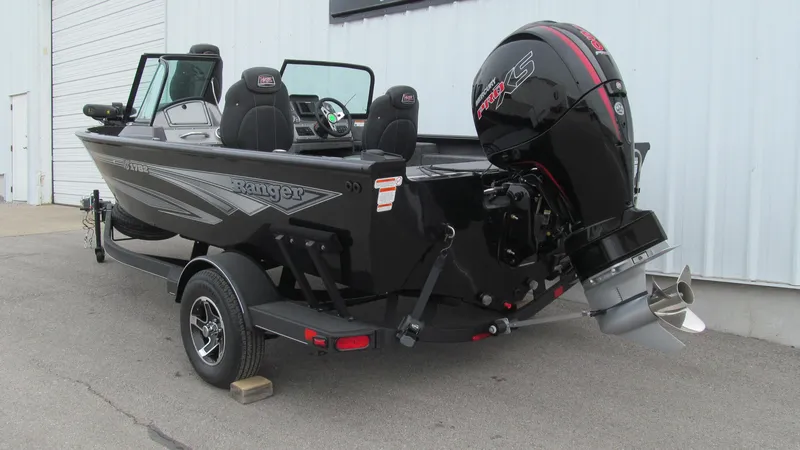 Slide: The Image of 2024 Ranger VS1782SC Reata boat with outboard motor, parked on a trailer. - 3