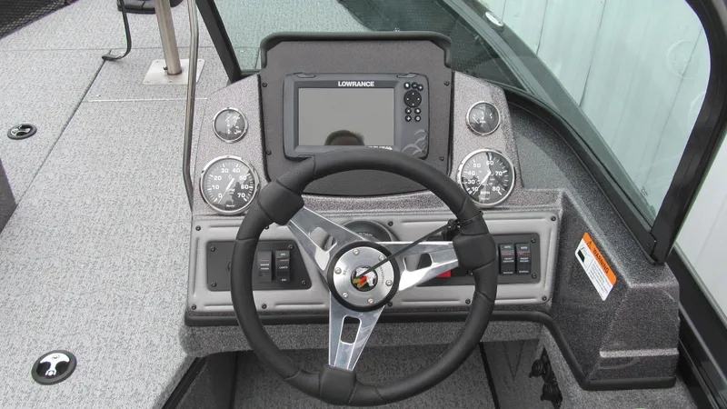 Slide: The Image of 2024 Ranger VS1782SC Reata boat dashboard with steering wheel and navigation system. - 6
