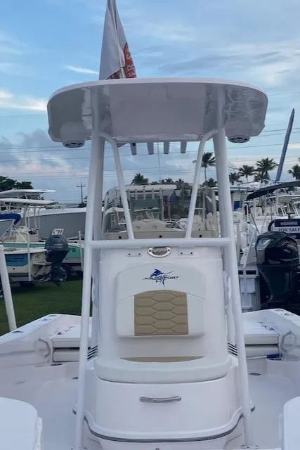 Slide: The Image of 2024 Aquasport 23 Pro Bay boat with T-top and center console. - 3