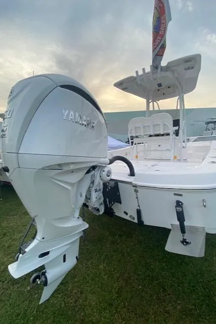 Slide: The Image of 2024 Aquasport 23 Pro Bay boat with Yamaha outboard motor. - 4