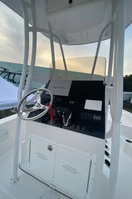 Slide: The Image of 2024 Aquasport 23 Pro Bay boat console with Garmin navigation system. - 5
