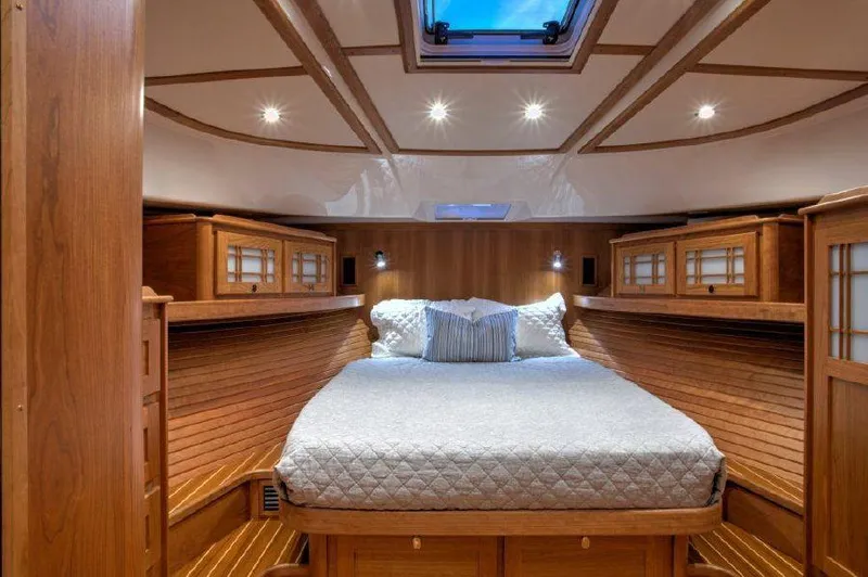 Slide: The Image of Luxurious bedroom interior of 2025 Sabre 58 Salon Express yacht with wooden finishes. - 11