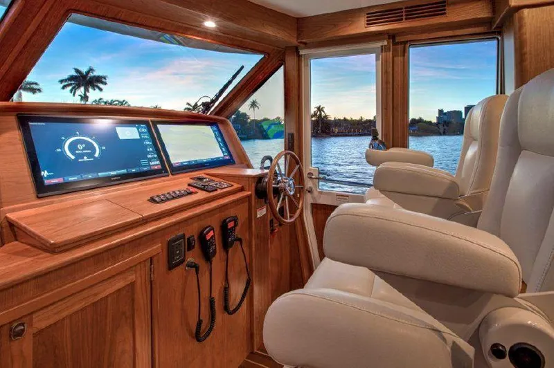 Slide: The Image of Interior helm of 2025 Sabre 58 Salon Express yacht with modern navigation system. - 5