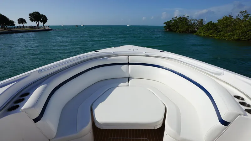Slide: The Image of 2016 Intrepid 475 Panacea boat with white seating, ocean view. - 10