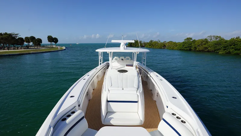 Slide: The Image of 2016 Intrepid 475 Panacea boat cruising in a scenic waterway. - 11