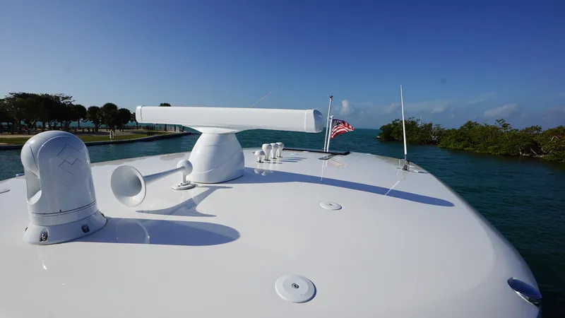 Slide: The Image of 2016 Intrepid 475 Panacea yacht bow with radar and American flag. - 12
